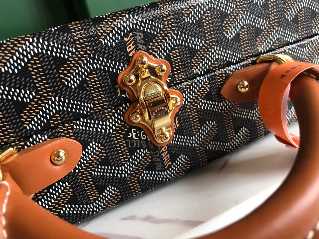 GRAND HÔTEL TRUNK BAG 24 IN BLACK GOYARDINE CANVAS AND TAN CALFSKIN