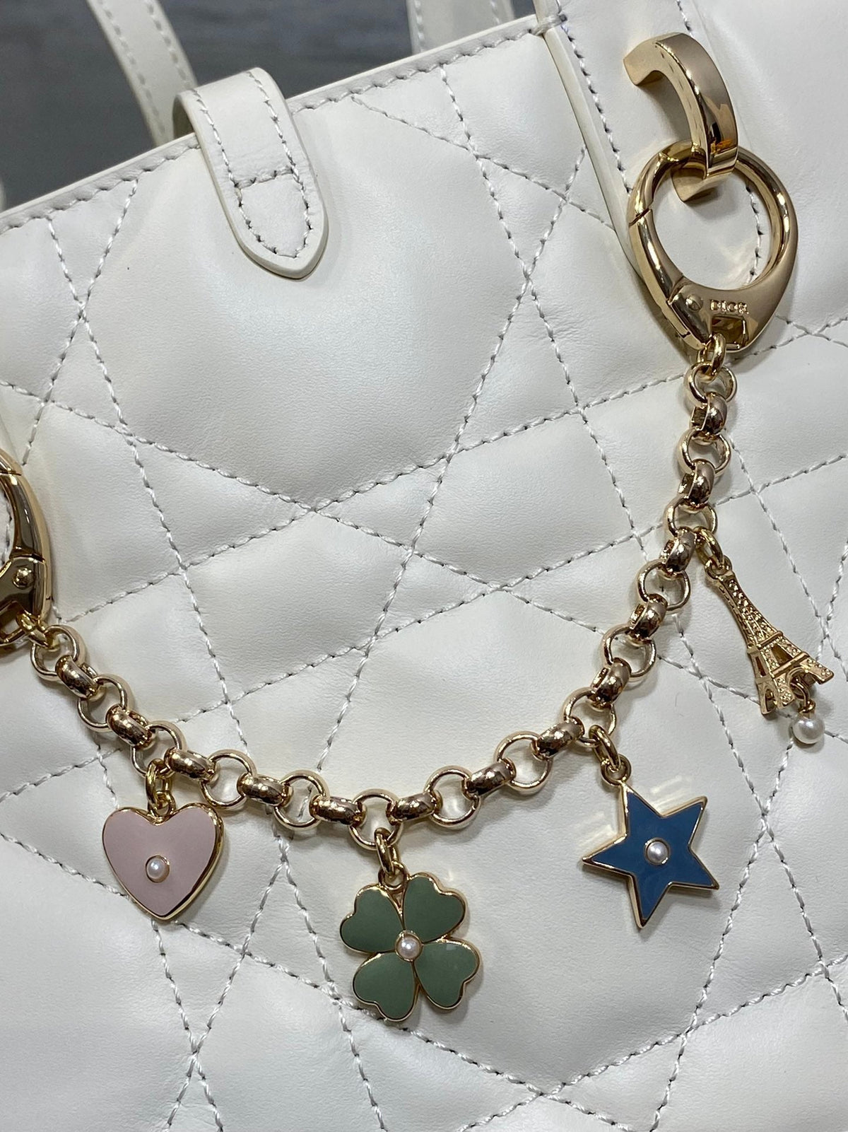 DIOR 25S TOUJOURS VERTICAL TOTE BAG 18 IN IVORY CALFSKIN WITH CHARM BRACELET STRAP