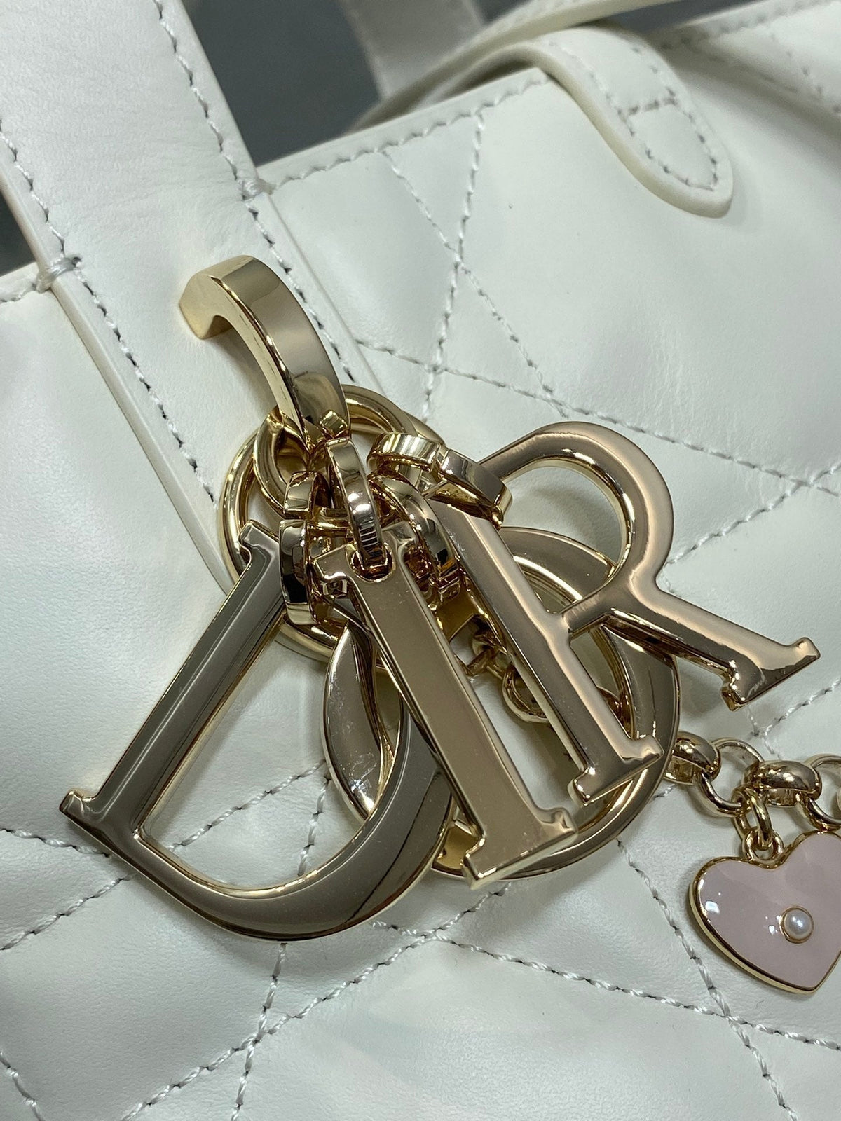 DIOR 25S TOUJOURS VERTICAL TOTE BAG 18 IN IVORY CALFSKIN WITH CHARM BRACELET STRAP