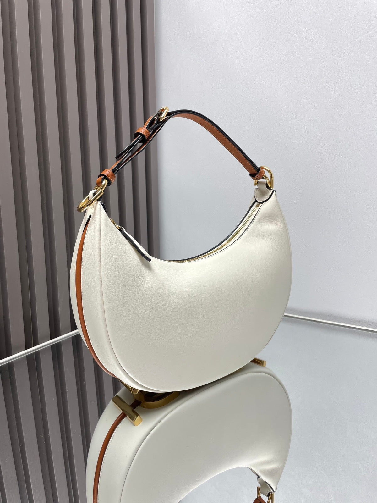 FENDIGRAPHY MEDIUM 29 IN WHITE AND ORANGE TRIM SMOOTH LAMBSKIN GOLD HARDWARE