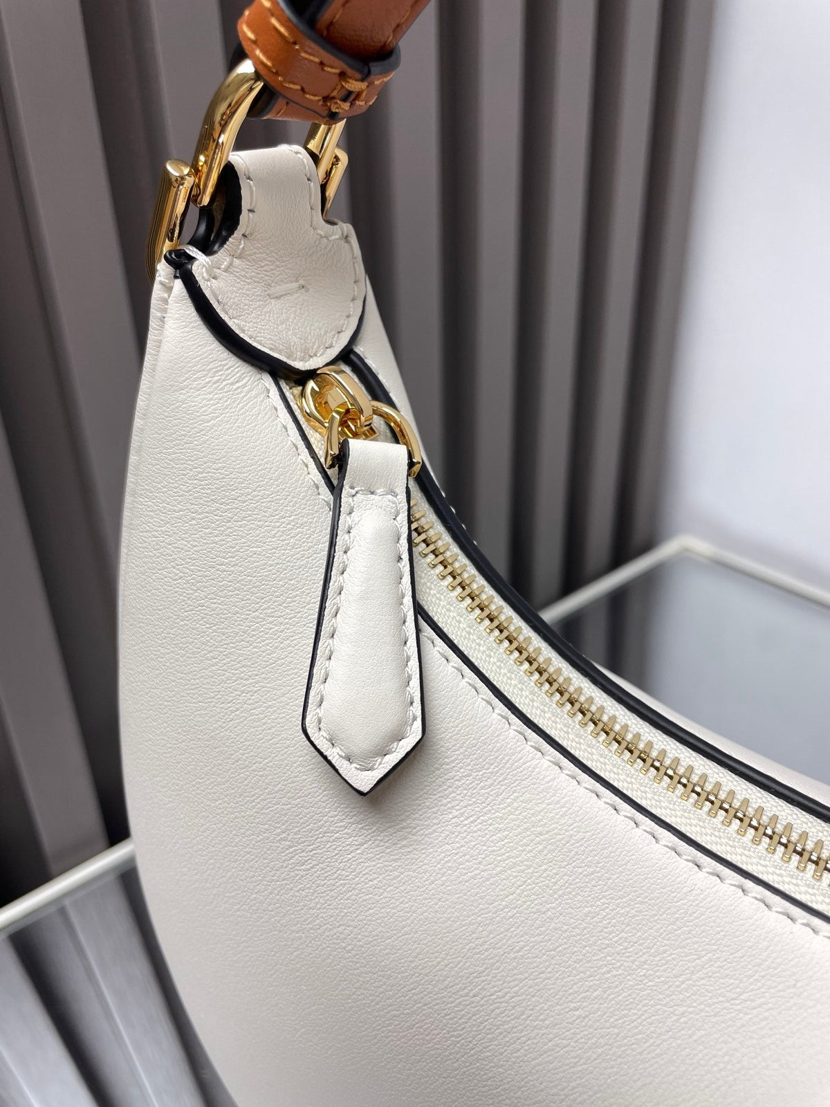 FENDIGRAPHY MEDIUM 29 IN WHITE AND ORANGE TRIM SMOOTH LAMBSKIN GOLD HARDWARE