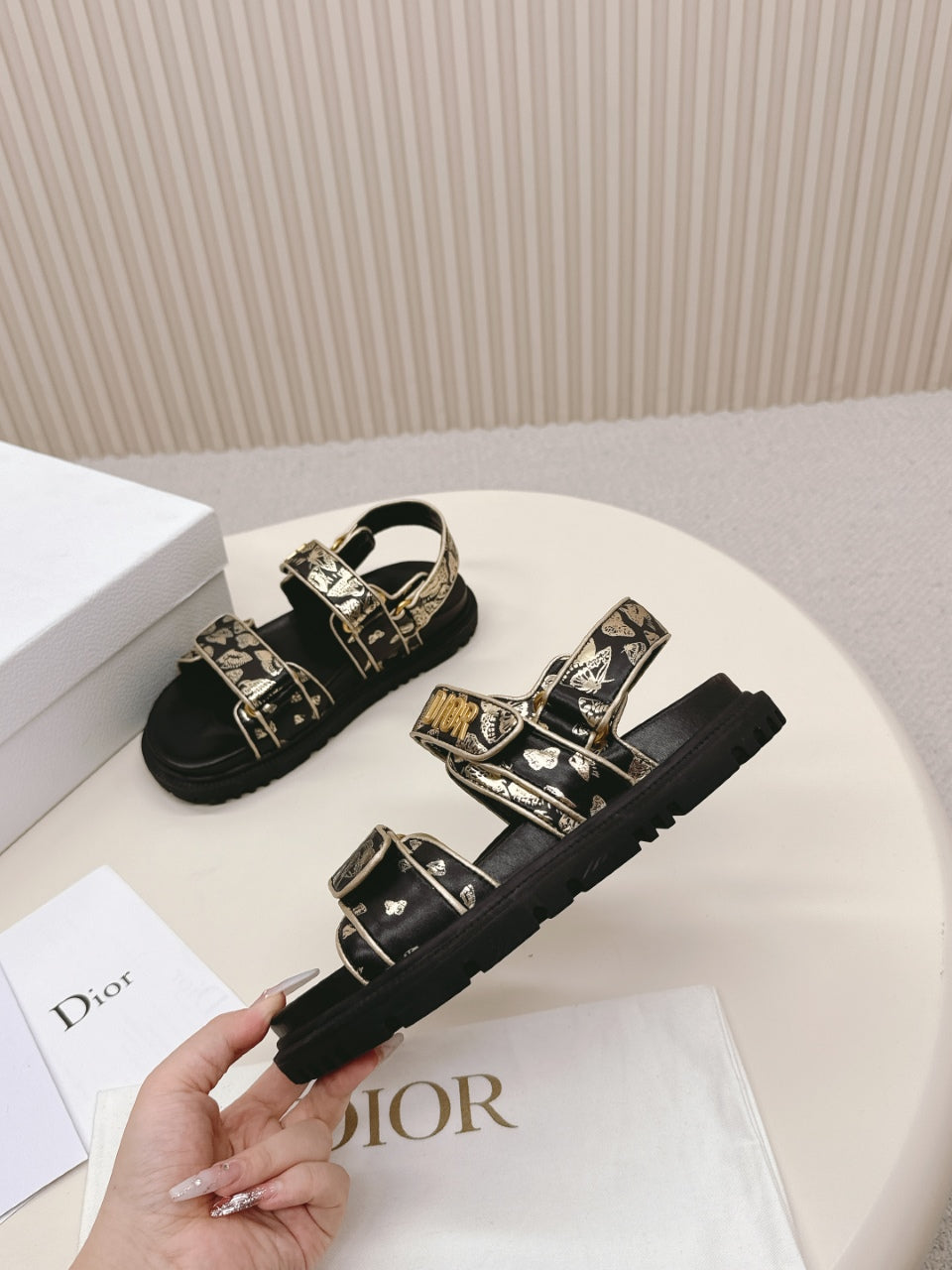 DIOR BACK-STRAP SANDALS 25S IN BLACK AND GOLD CALFSKIN WITH BUTTERFLY MOTIF