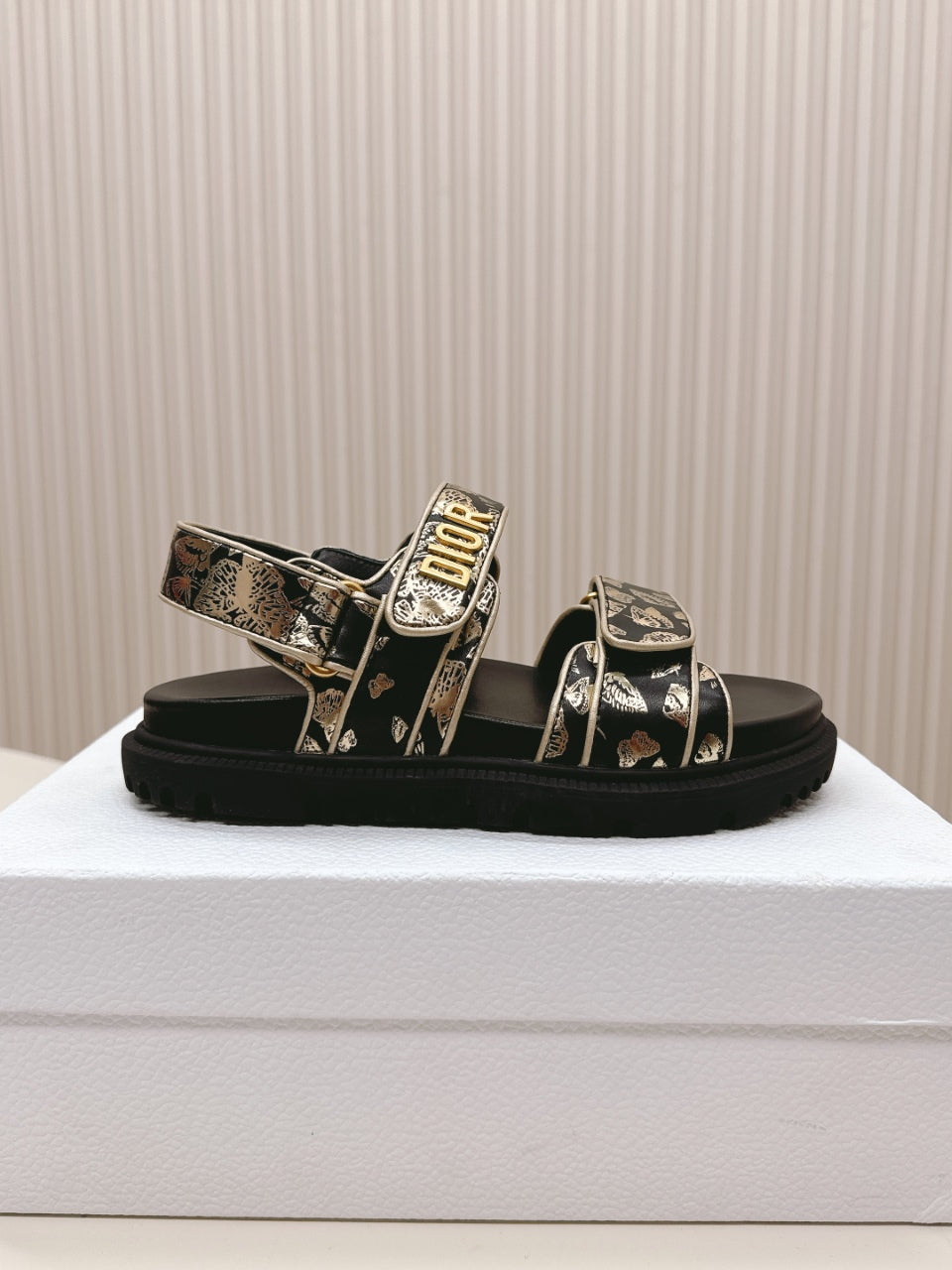 DIOR BACK-STRAP SANDALS 25S IN BLACK AND GOLD CALFSKIN WITH BUTTERFLY MOTIF
