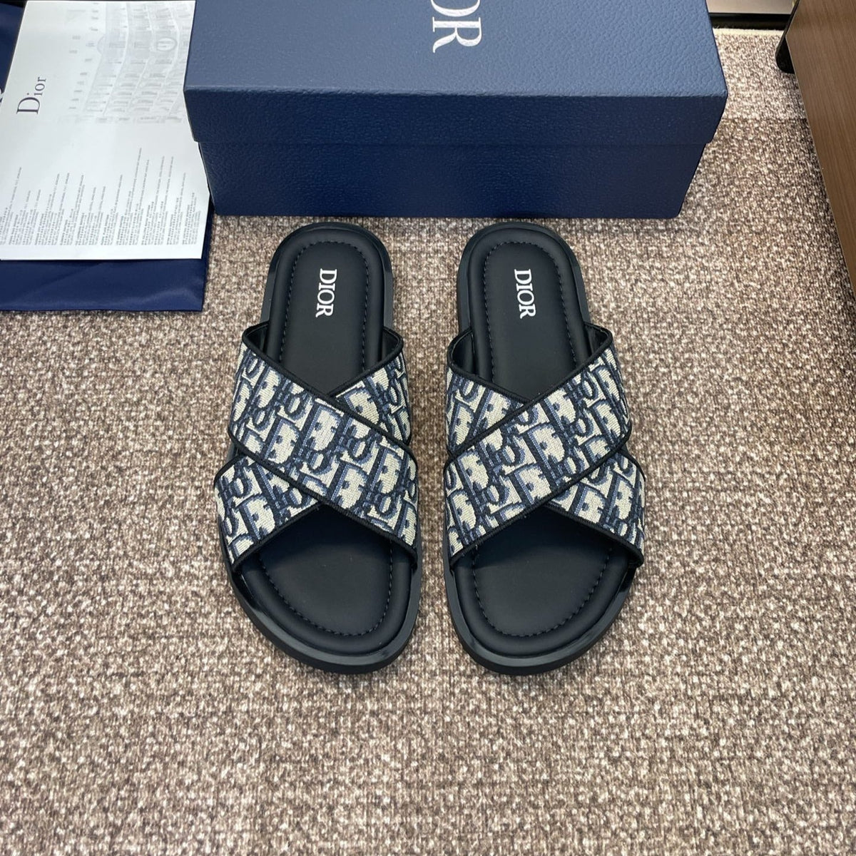 DIOR 25S ALIAS CROSS-STRAP SLIDES IN BLACK CALFSKIN WITH CD OBLIQUE DEEP BLUE LOGO