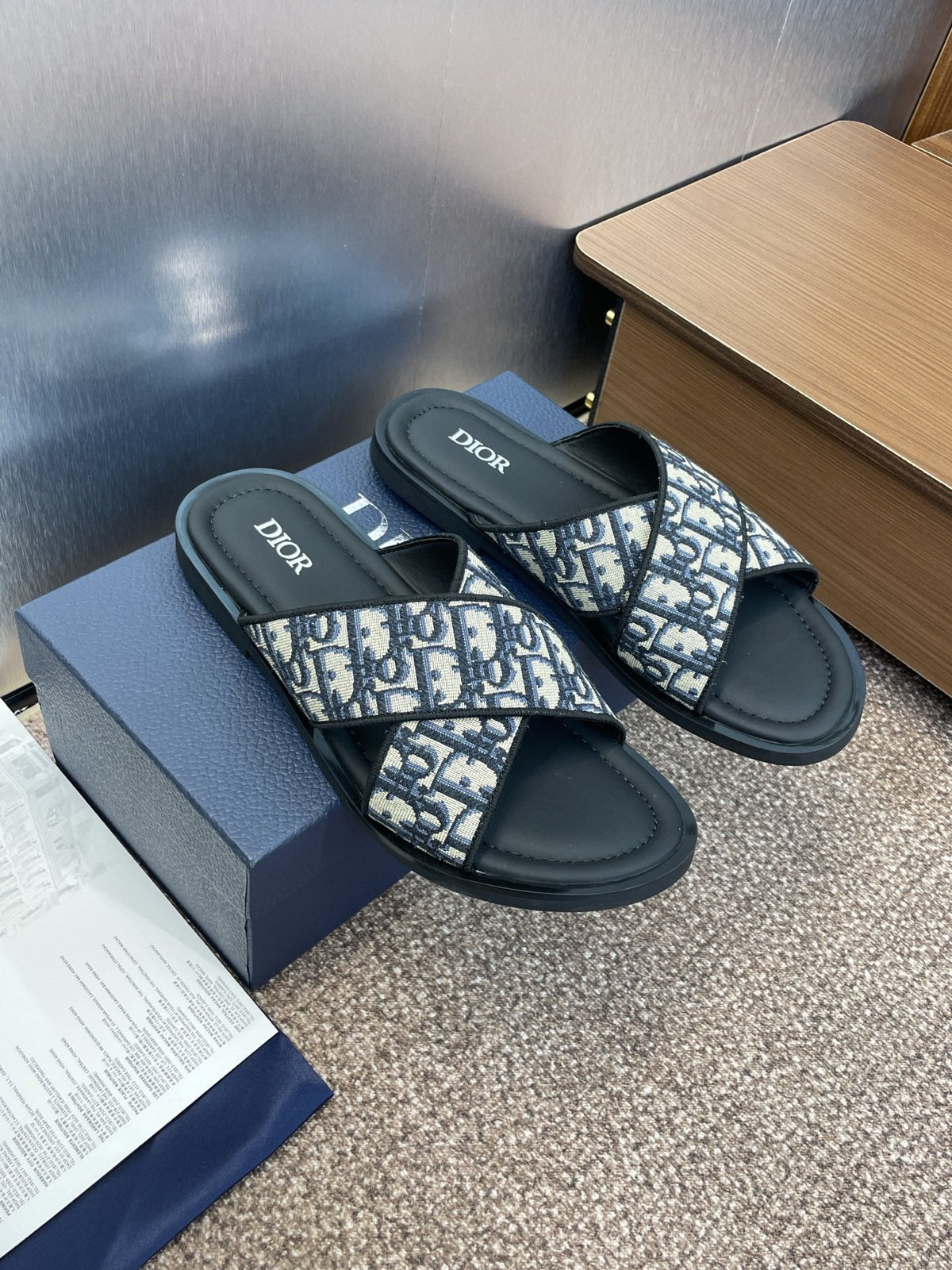DIOR 25S ALIAS CROSS-STRAP SLIDES IN BLACK CALFSKIN WITH CD OBLIQUE DEEP BLUE LOGO